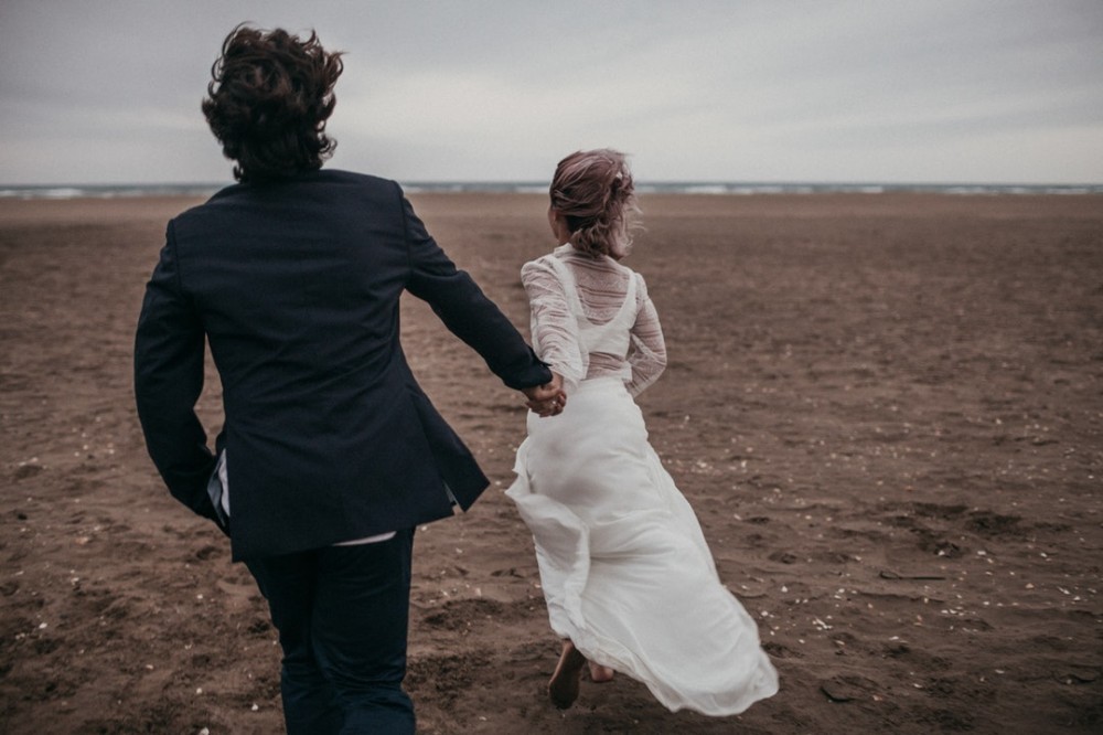 Bride and groom on beach