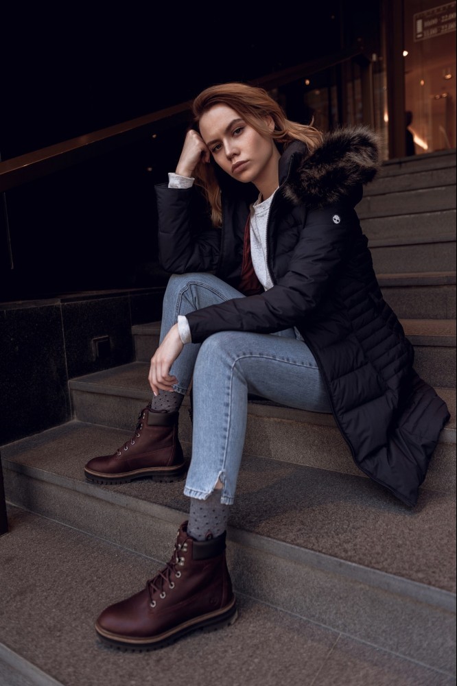 angry woman sitting on concrete steps