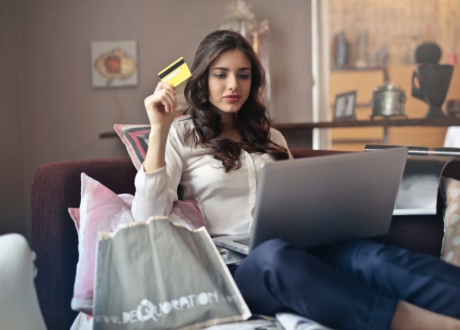 woman online shopping with credit card